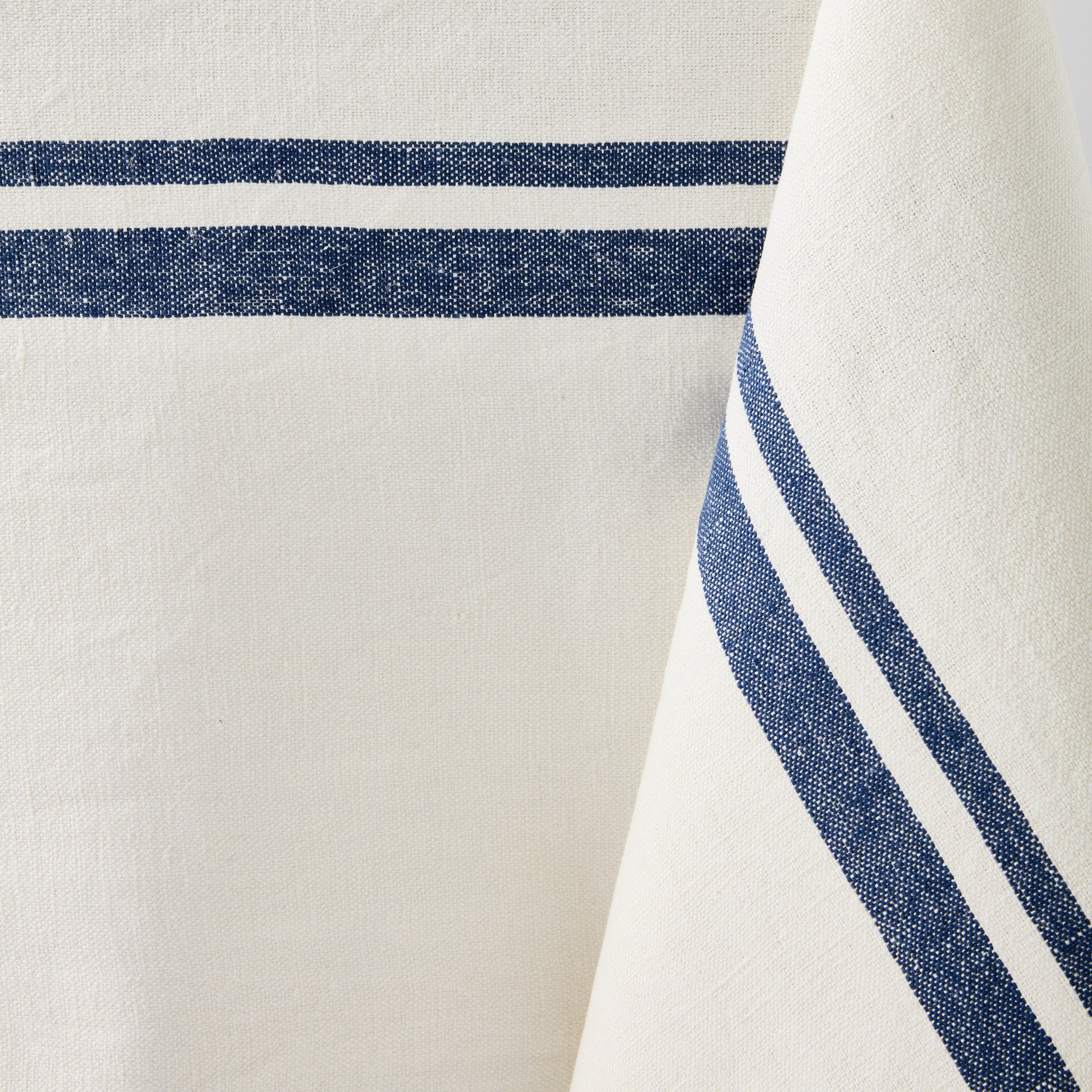 Navy Boat Stripe Tablecloth, cotton-linen blend, with horizontal navy blue stripes on a white background.