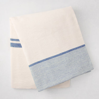 Folded Navy Boat Stripe Tablecloth, 70"x108", cotton-linen blend, with blue horizontal stripes.