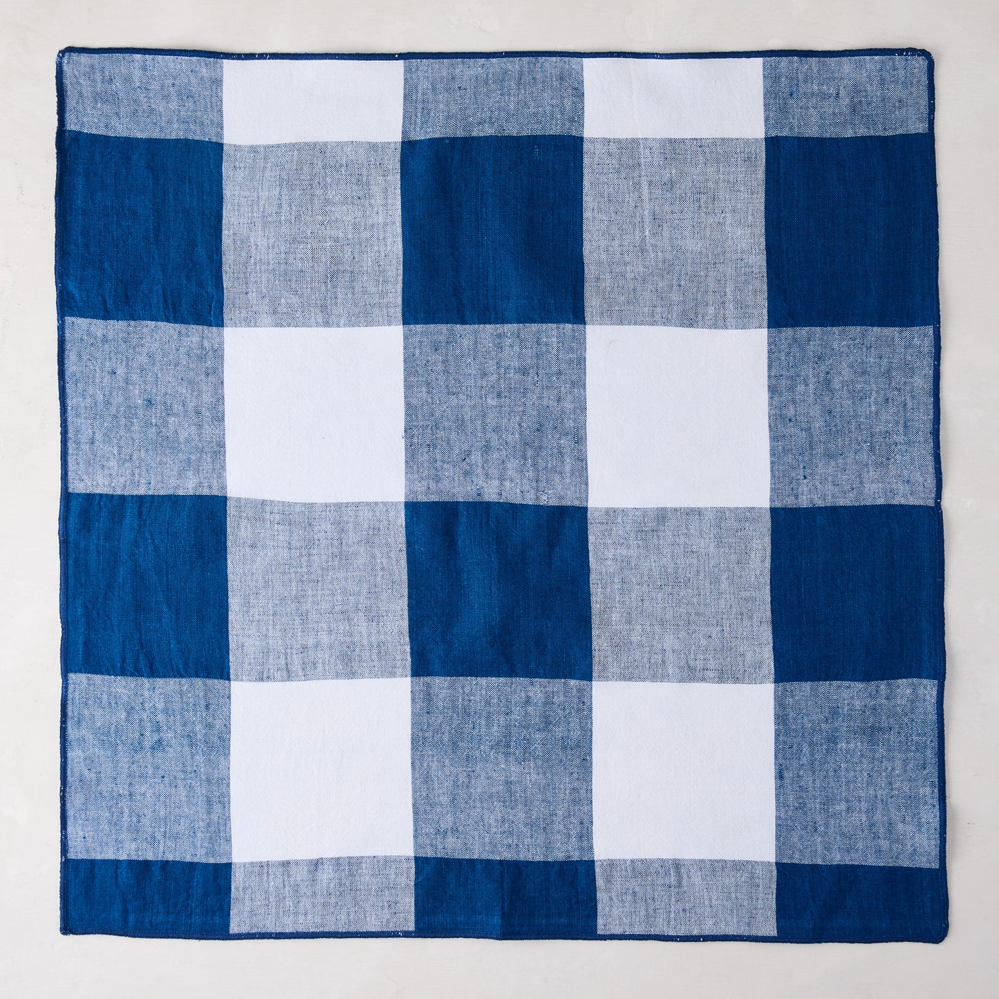 Navy Blue Buffalo Check Linen Napkin, 20" x 20", folded square.