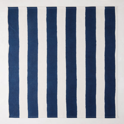 Navy Hampton Stripe Cotton Napkin, 22" square, with thick vertical navy and white stripes.