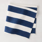 Folded Navy Hampton Stripe Cotton Napkin, 22" square, with thick blue and white stripes.