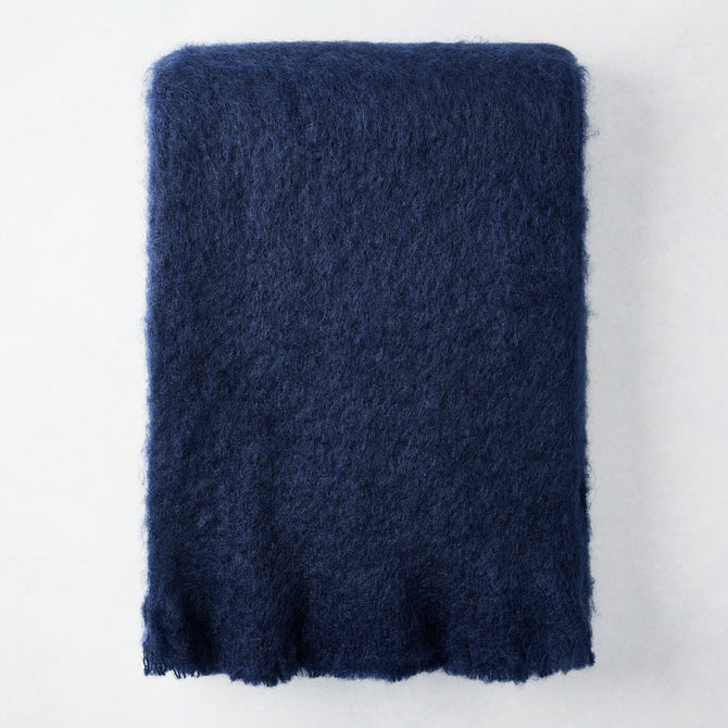Navy blue mohair throw blanket, 72"L x 51"W, with a soft, fuzzy texture.
