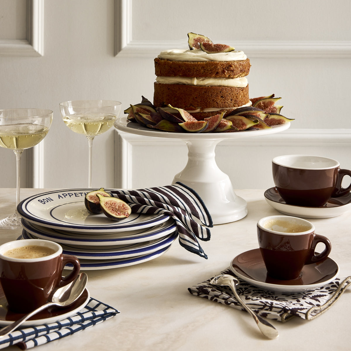 Navy blue Bon Appetit ceramic salad plate with hand-painted lines, 7.8-inch diameter, stacked on a table setting.