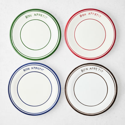 Set of four 7.8-inch ceramic salad plates with hand-painted Bon Appetit text and colored rims in blue, red, green, and brown.