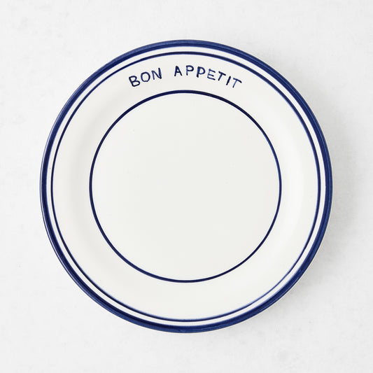 Navy blue and white ceramic salad plate with "Bon Appetit" text and double navy blue rim.