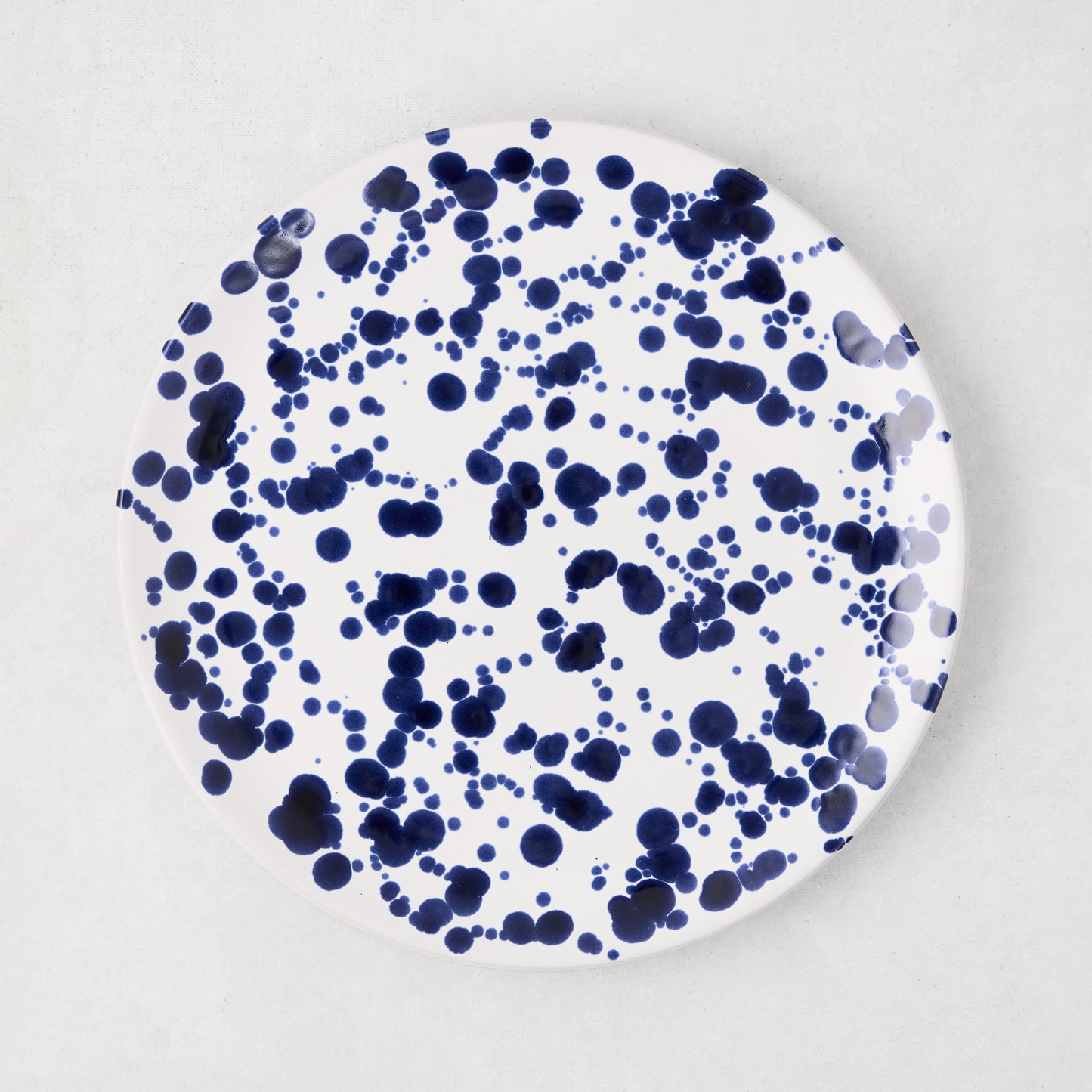 Navy Splatter Salad Plate, 9"Dia stoneware, white with hand-splattered navy blue dots.
