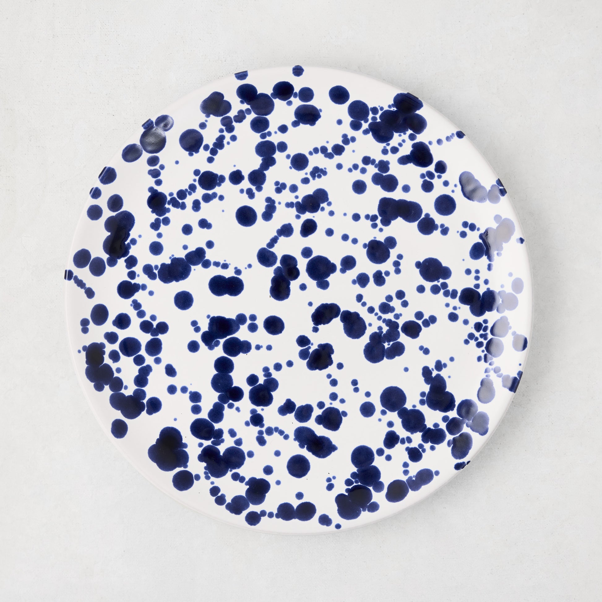 Navy Splatter Salad Plate, 9"Dia stoneware, white with hand-splattered navy blue dots.