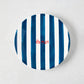 Hand-painted Italian ceramic appetizer plate with navy blue stripes and red "La Mer" text.