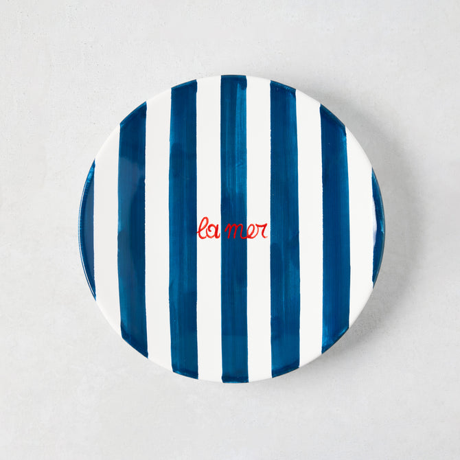 Hand-painted Italian ceramic appetizer plate with navy blue stripes and red "La Mer" text.