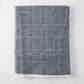 Navy Blue Sutton Houndstooth Throw Blanket, 72"L x 51"W, with fringed edge.