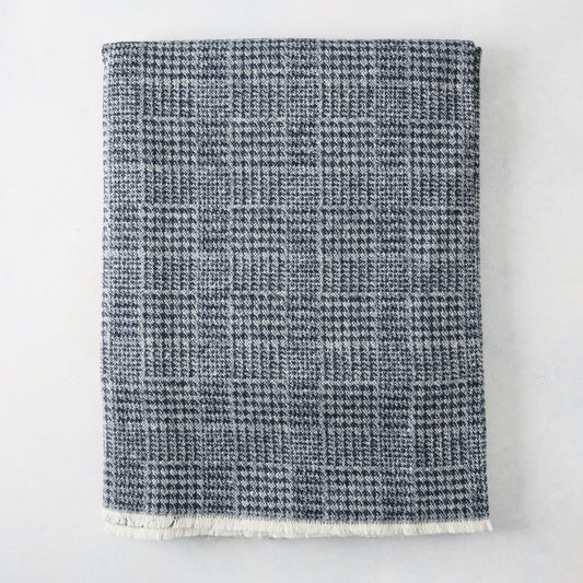 Navy Blue Sutton Houndstooth Throw Blanket, 72"L x 51"W, with fringed edge.