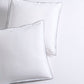Set of two white percale Euro shams with navy piped edges and subtle double-stitch detailing.