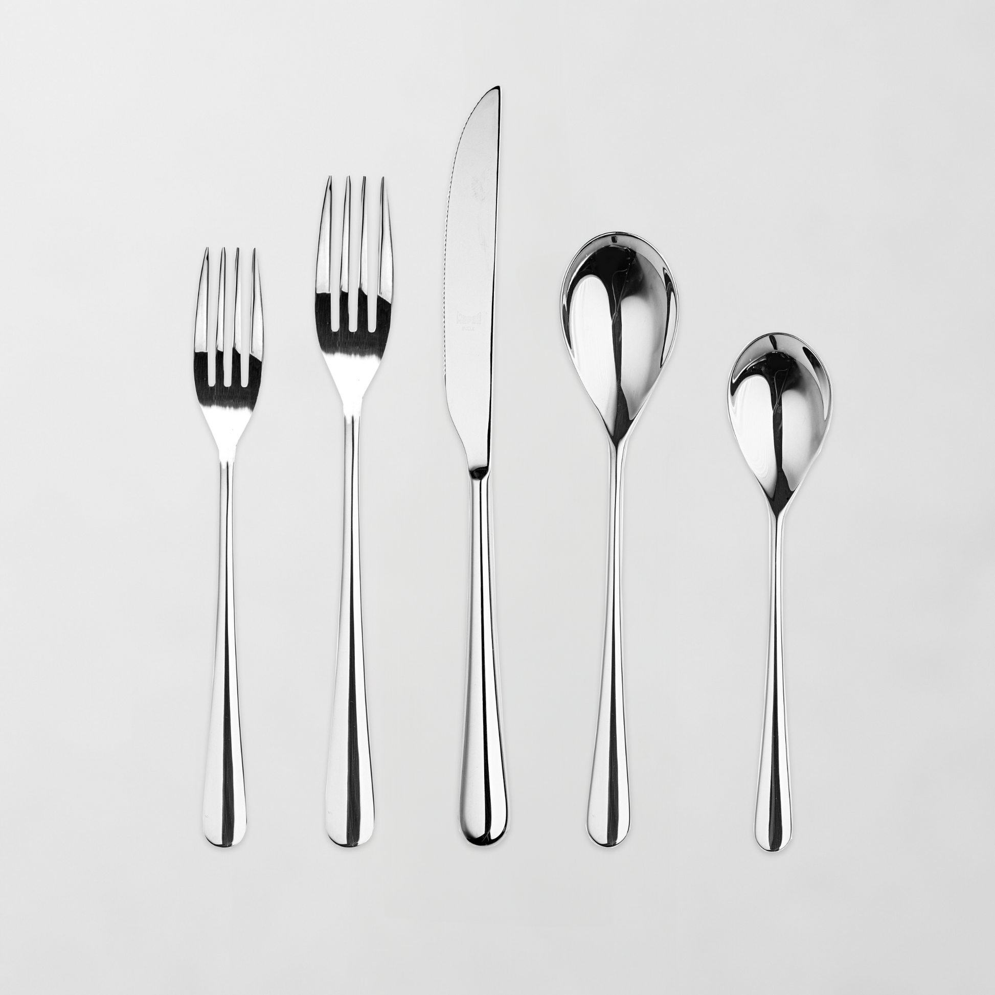 Neve Mirrored 5-piece flatware set: polished 18/10 stainless steel forks, knife, and spoons.