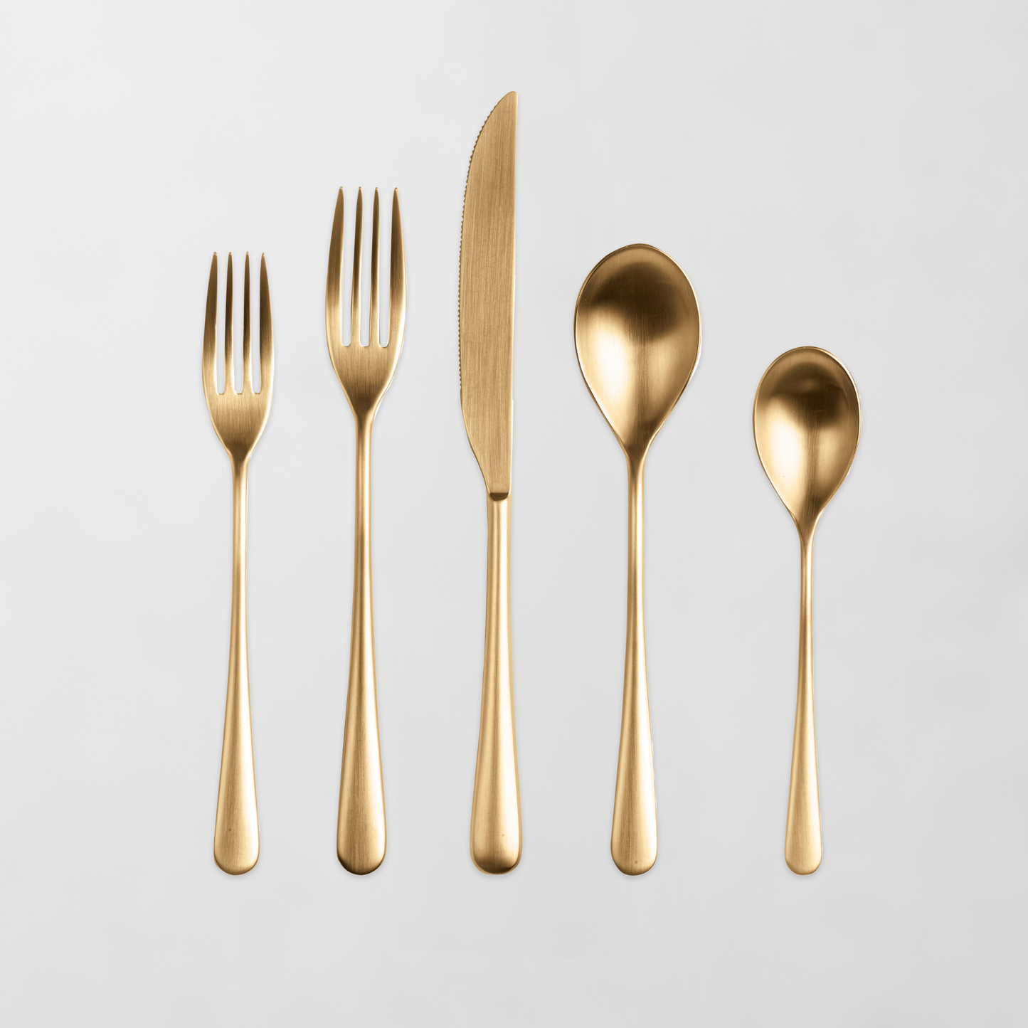 Neve Oro Ice 5-piece flatware set with gold finish, 18/10 stainless steel, slim handles.