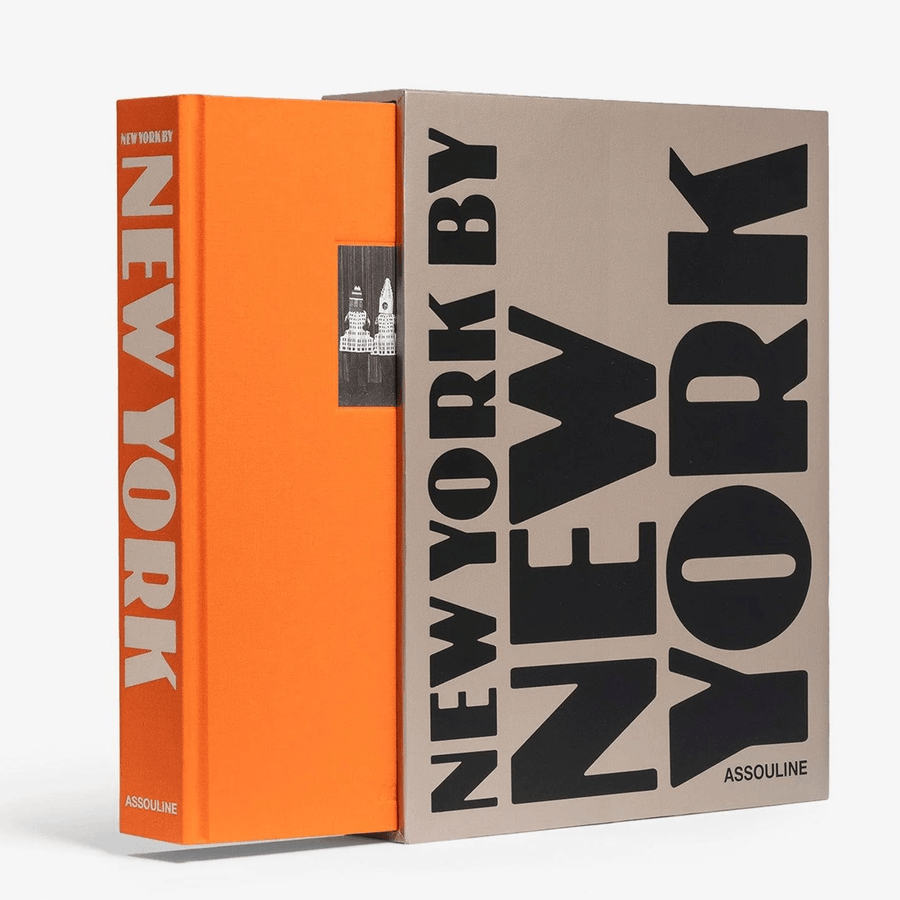 Orange linen hardcover "New York By New York" book with a beige slipcase featuring bold black typography.