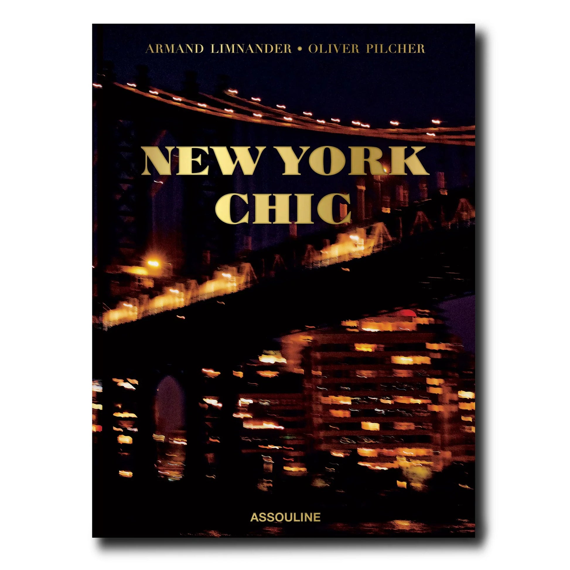 New York Chic" silk hardcover book with gold title over a blurred night city bridge scene.