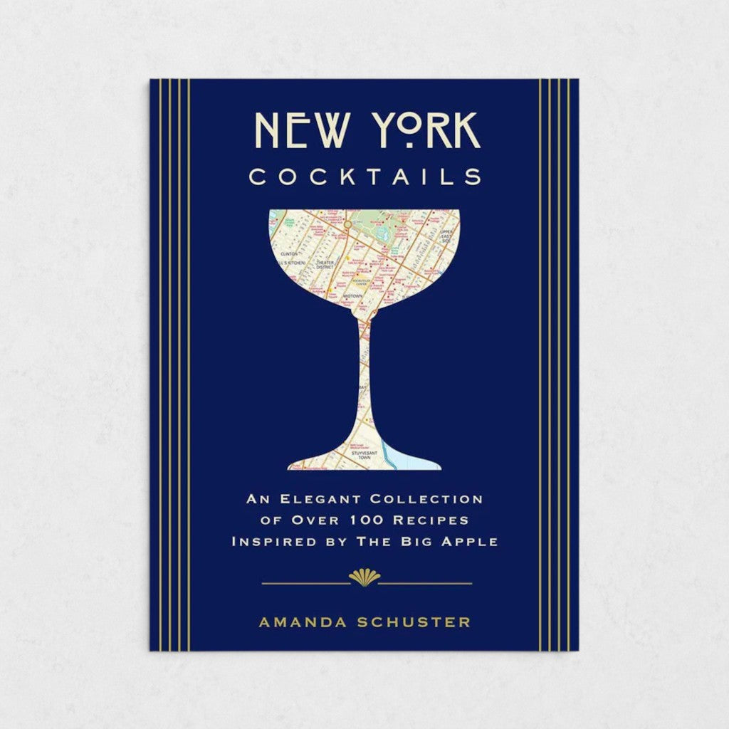New York Cocktails book with a navy blue cover, gold stripes, and a map of NYC in a cocktail glass silhouette.