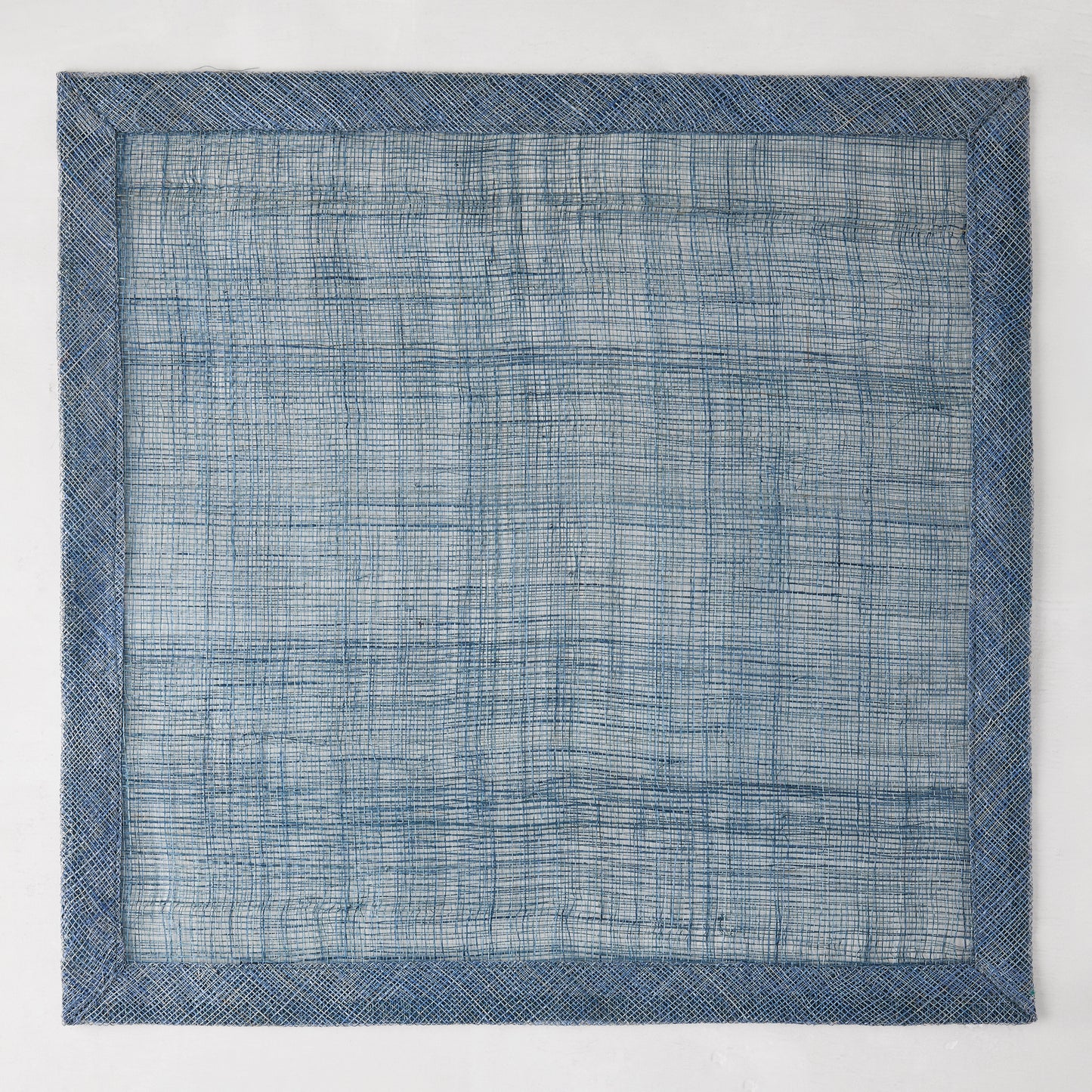 Newport Blue 15" square Abaca placemat with a deeper blue woven border.