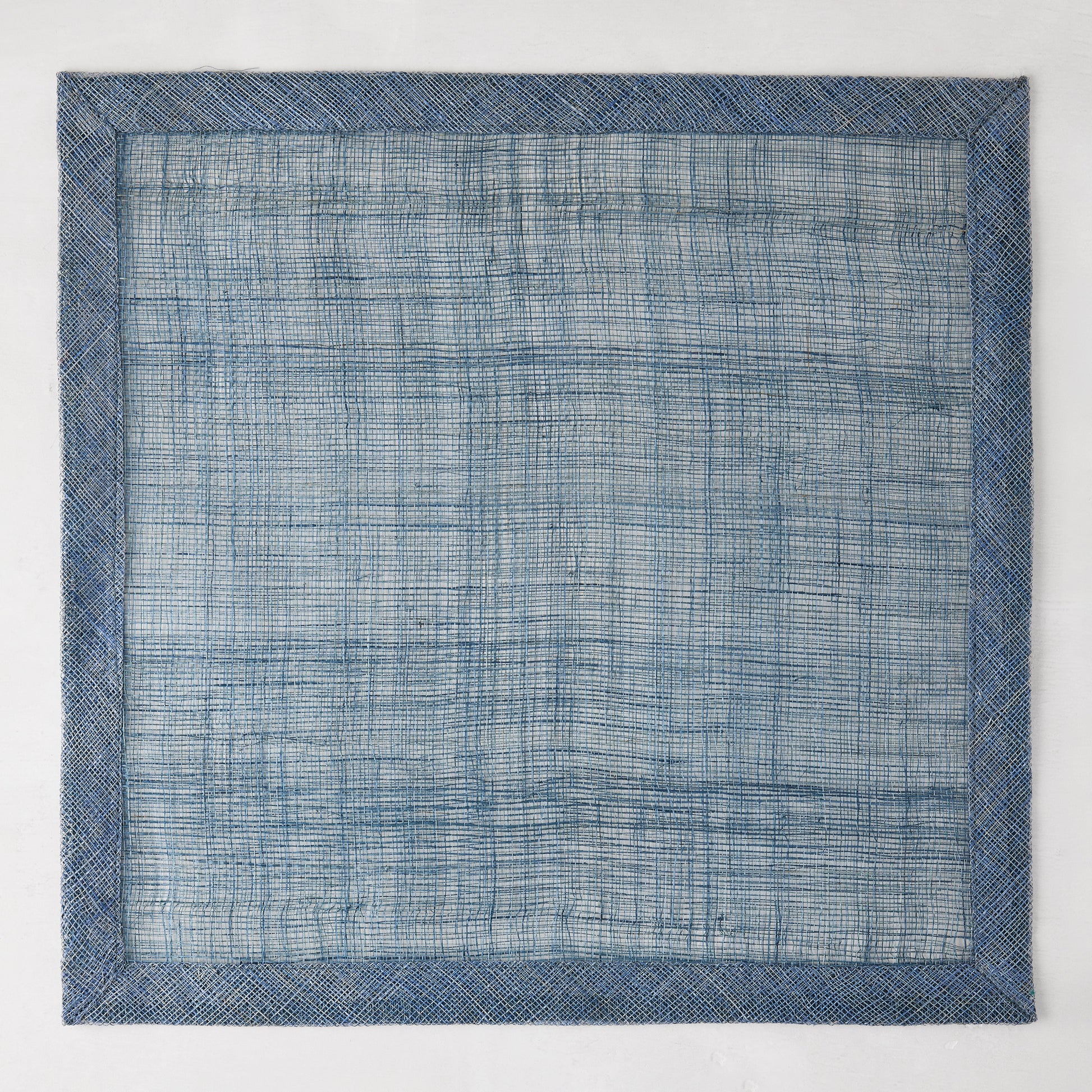 Newport Blue 15" square Abaca placemat with a deeper blue woven border.