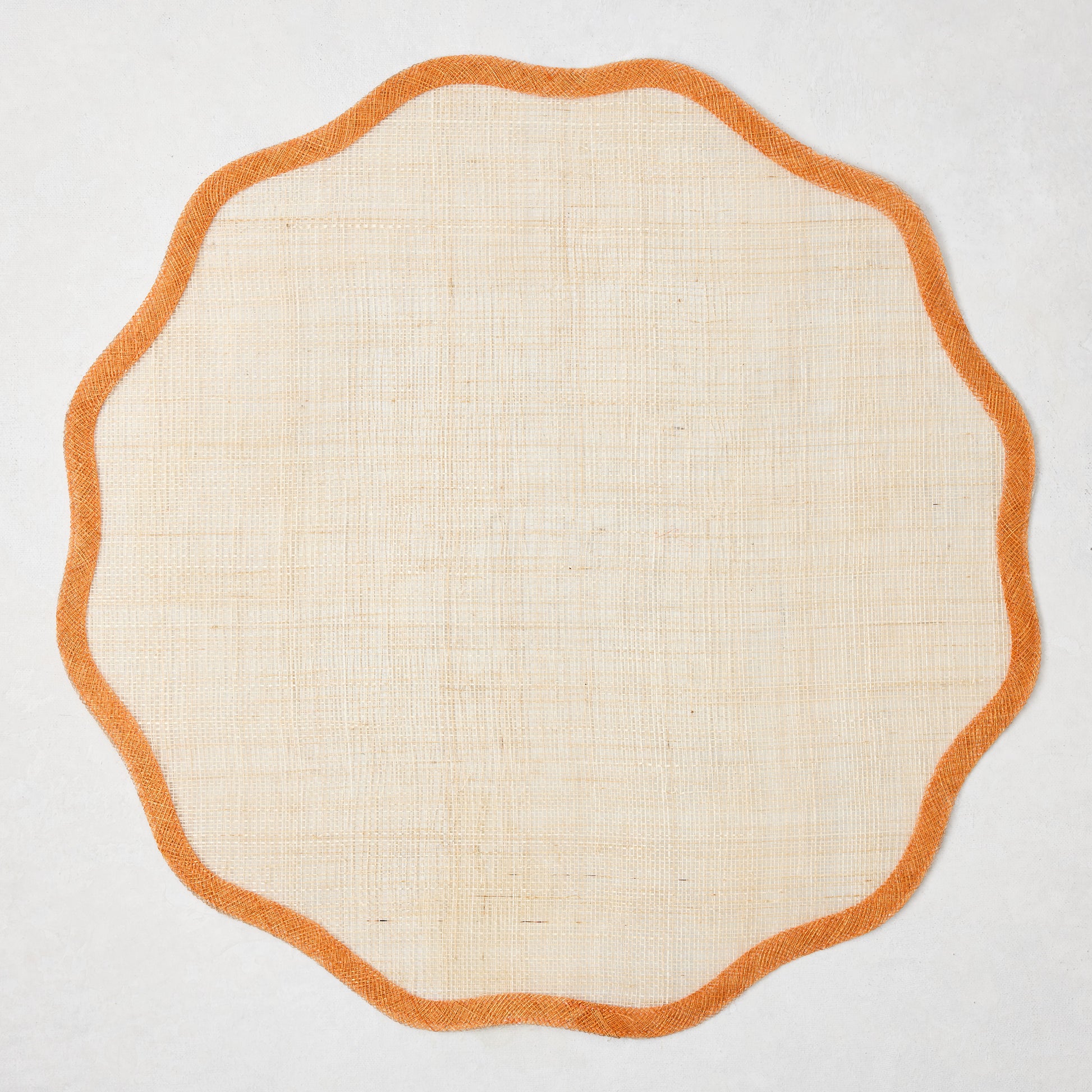 Newport Orange Scalloped Placemat, natural abaca with orange border, 16" Dia.