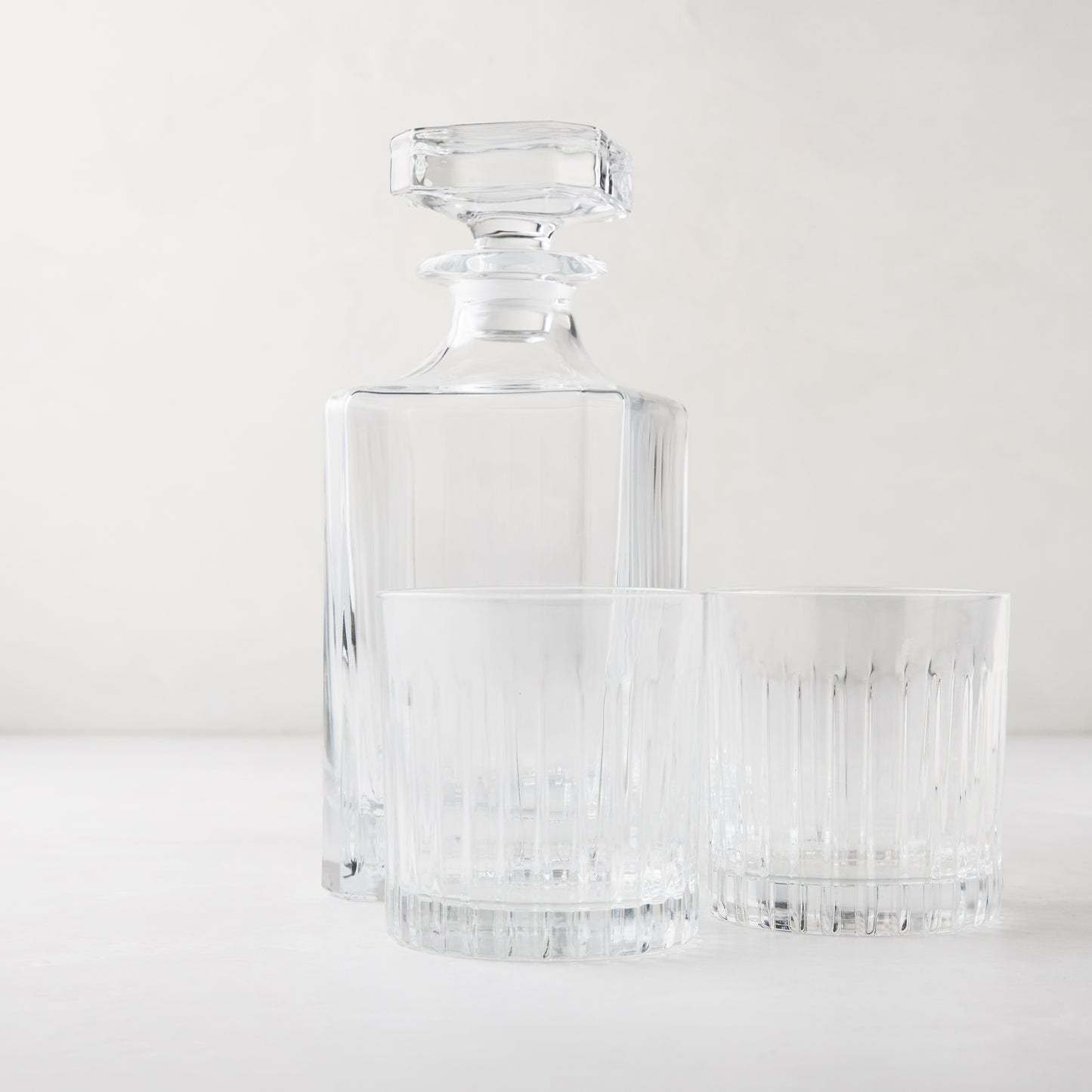 Regent Nightcap Gift Set: Clear eco-crystal decanter and two 11oz old-fashioned glasses with etched lines.