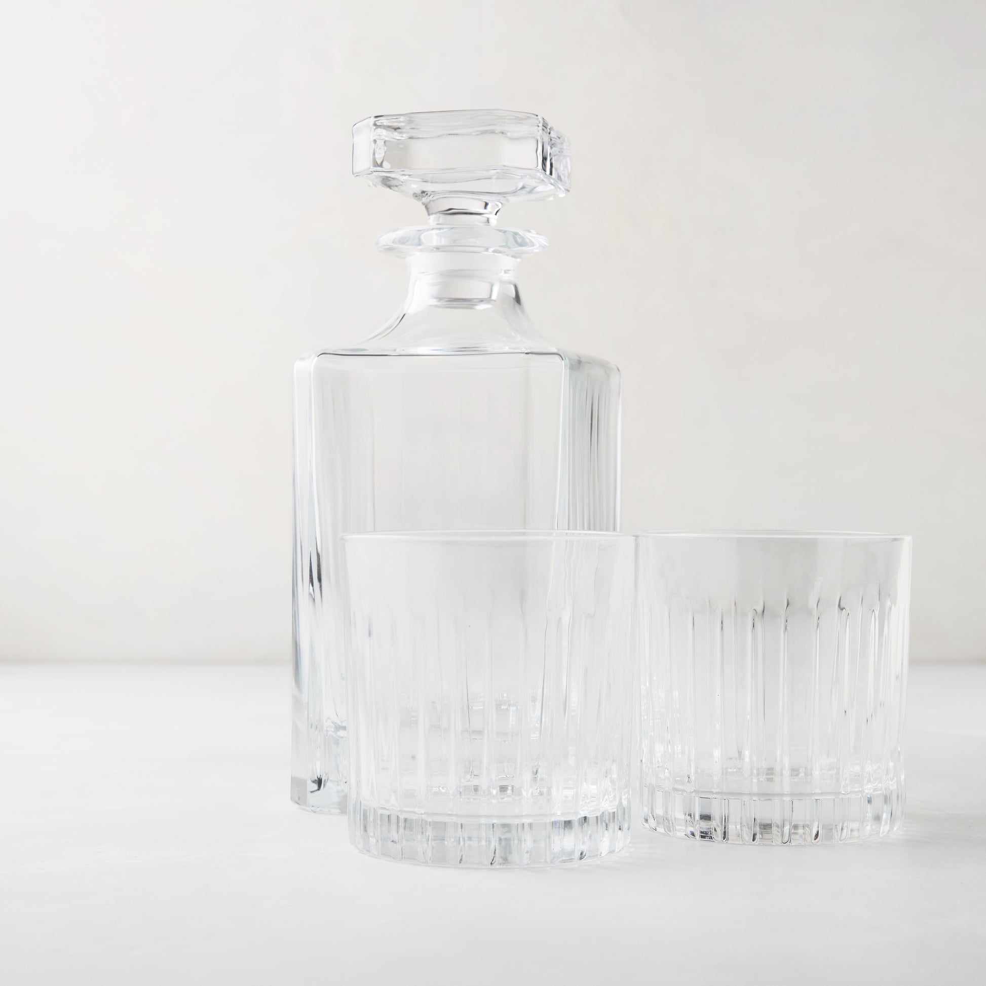Regent Nightcap Gift Set: Clear eco-crystal decanter and two 11oz old-fashioned glasses with etched lines.