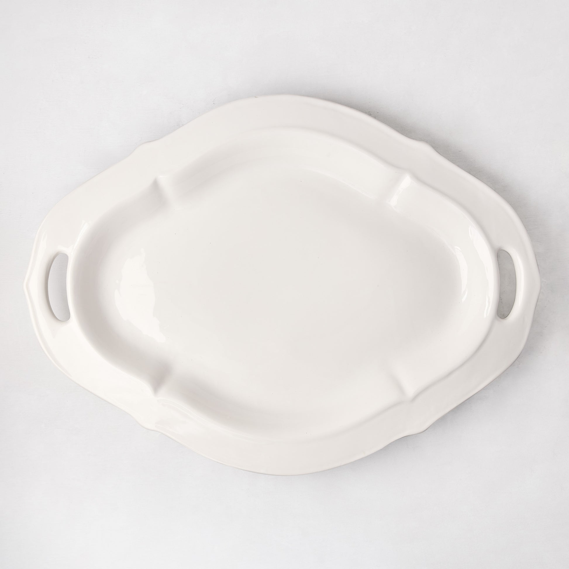 Nonna Ceramic Handled Serving Platter, oversized white Italian ceramic platter with decorative handles.