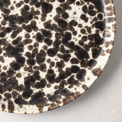 Nuno Splatter 11" stoneware dinner plate with unique brown spots on a pale cream base.
