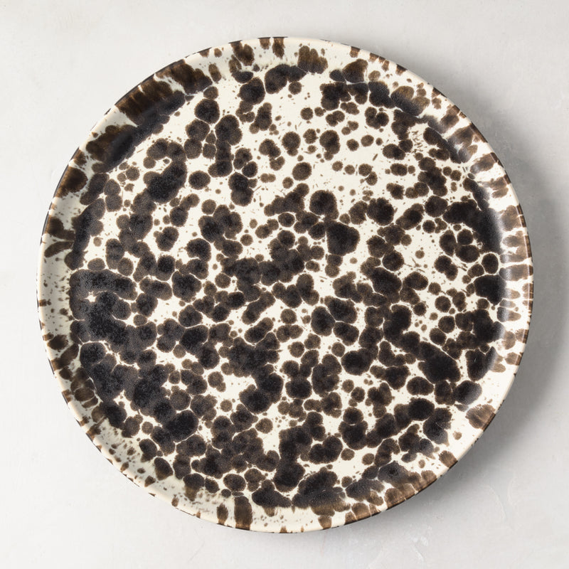 Nuno Splatter 11" stoneware dinner plate with unique brown spots on a pale cream base.