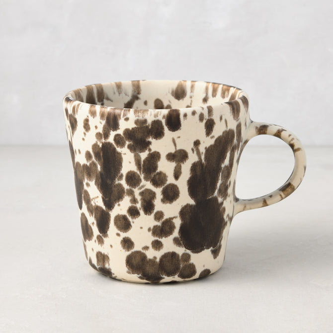 Nuno Splatter Stoneware Mug, hand-painted with unique brown spots on a pale cream base.