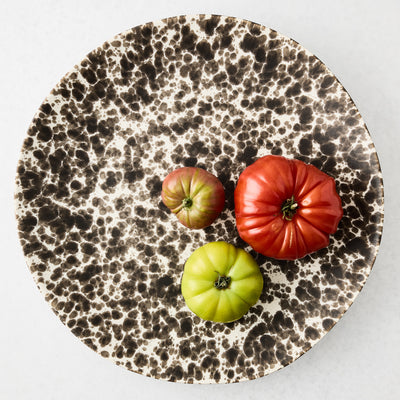 Nuno Splatter Stoneware Round Serve Platter, 15.55"Dia, with brown splatter on cream base.