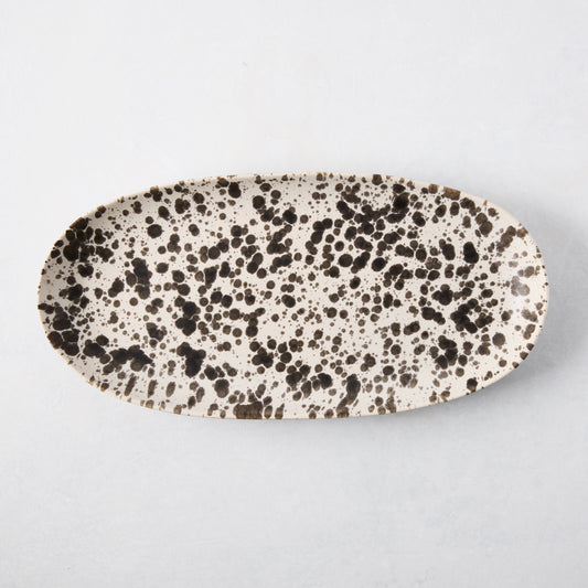 Nuno Splatter oval stoneware serving platter, pale cream with unique brown splatter design.