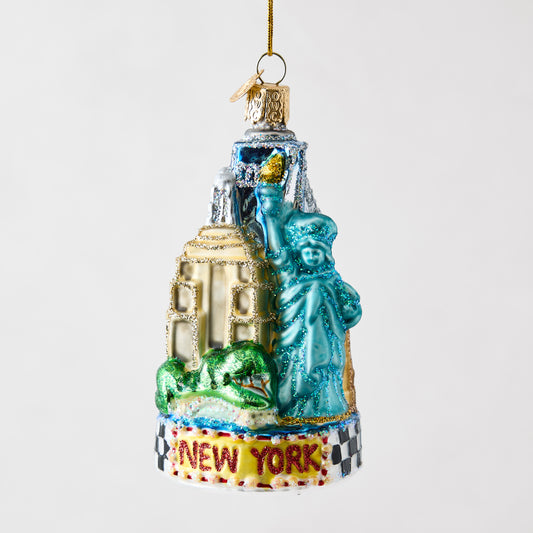 Hand-painted glass and resin NYC skyline ornament featuring the Statue of Liberty and Empire State Building with glitter.