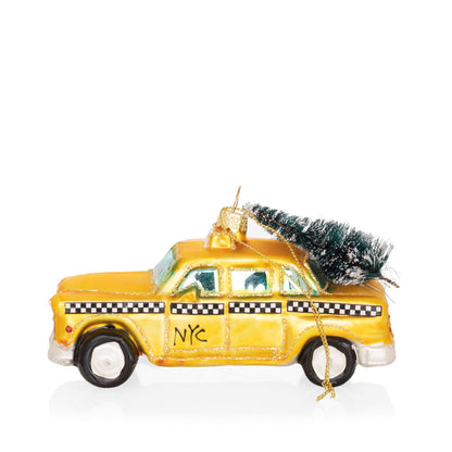 5-inch mouth-blown glass NYC taxi cab Christmas ornament with glitter and a miniature pine tree on the roof.