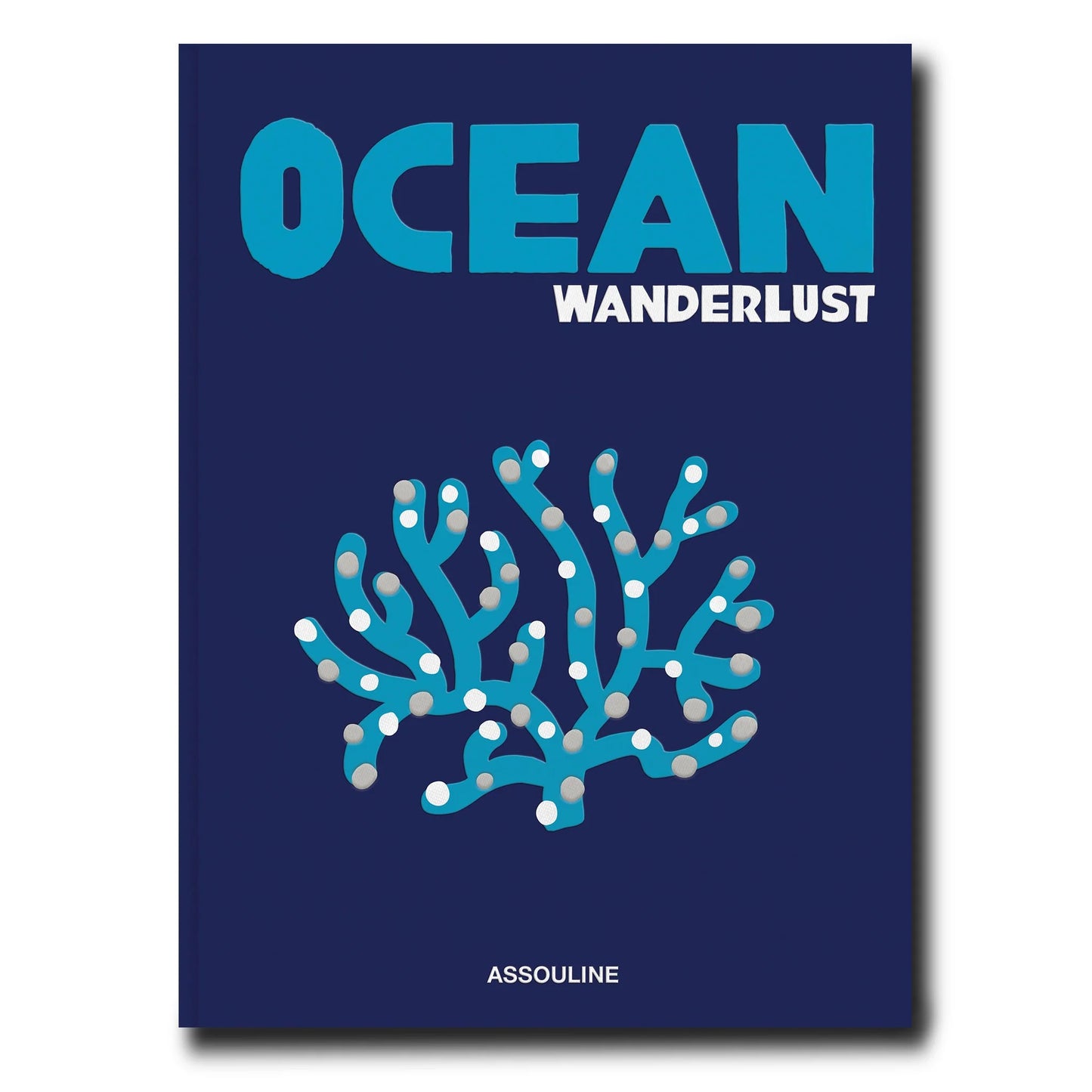 Ocean Wanderlust linen hardcover book with blue title and coral illustration on a navy background.