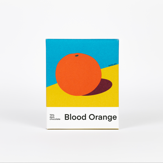 Ocelot Blood Orange Dark Chocolate bar with a blue, yellow, and orange graphic design.