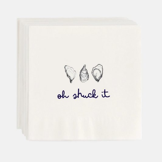 White 5.5" square paper cocktail napkins with "oh shuck it" text and oyster shell illustrations.