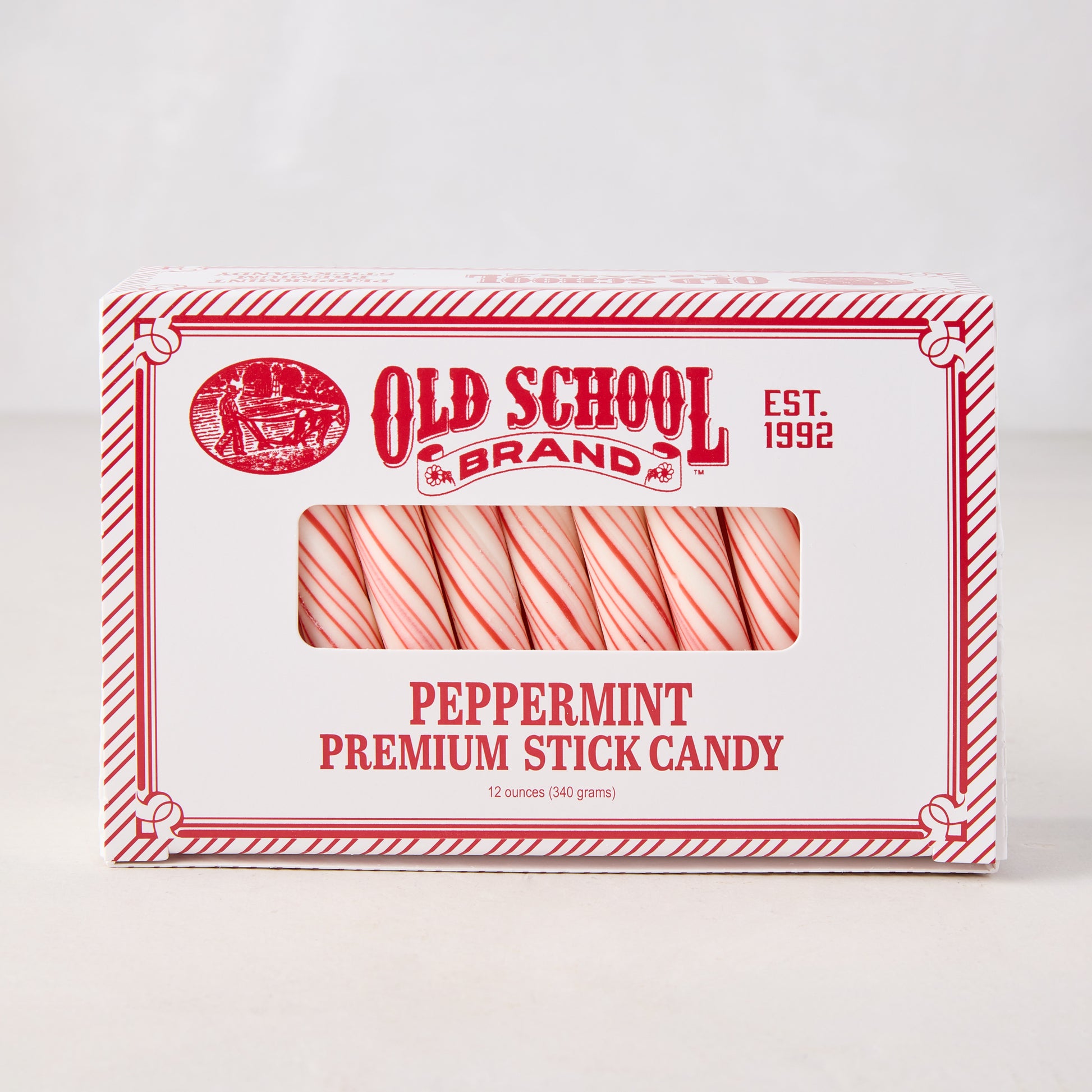 Old School Brand Peppermint Premium Stick Candy box with red and white striped sticks visible.