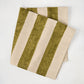Folded Olive Green Hampton Stripe Natural Cotton Napkin with wide green and khaki stripes.