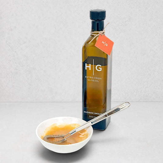 Hudson Grace Olive Oil Gift Set: dark bottle, white dipping bowl with oil, mini whisk.