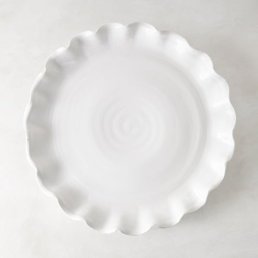 White Onda Round Ceramic Serving Platter, 20"Dia, with a playful ruffled edge.