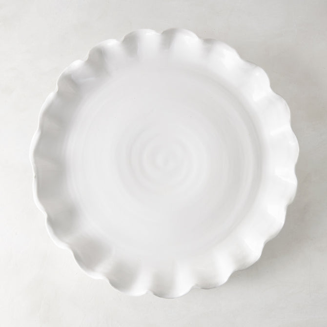 White Onda Round Ceramic Serving Platter, 20"Dia, with a playful ruffled edge.