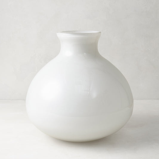 Hand-blown opaque white glass vase with a round, geometric silhouette, 10.5 inches tall.