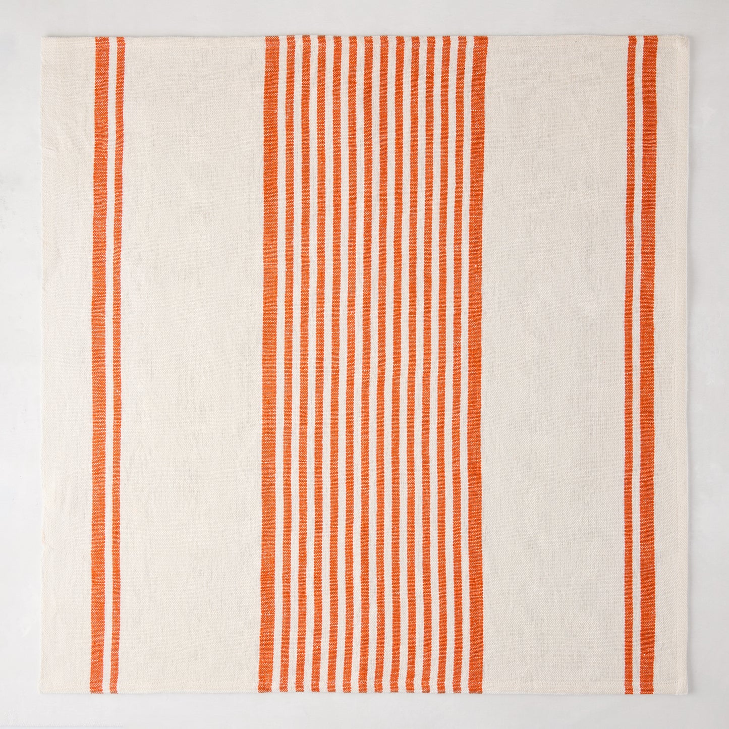 Orange Boat Stripe Napkin, 22" square, cotton-linen blend, with vertical orange stripes on cream.