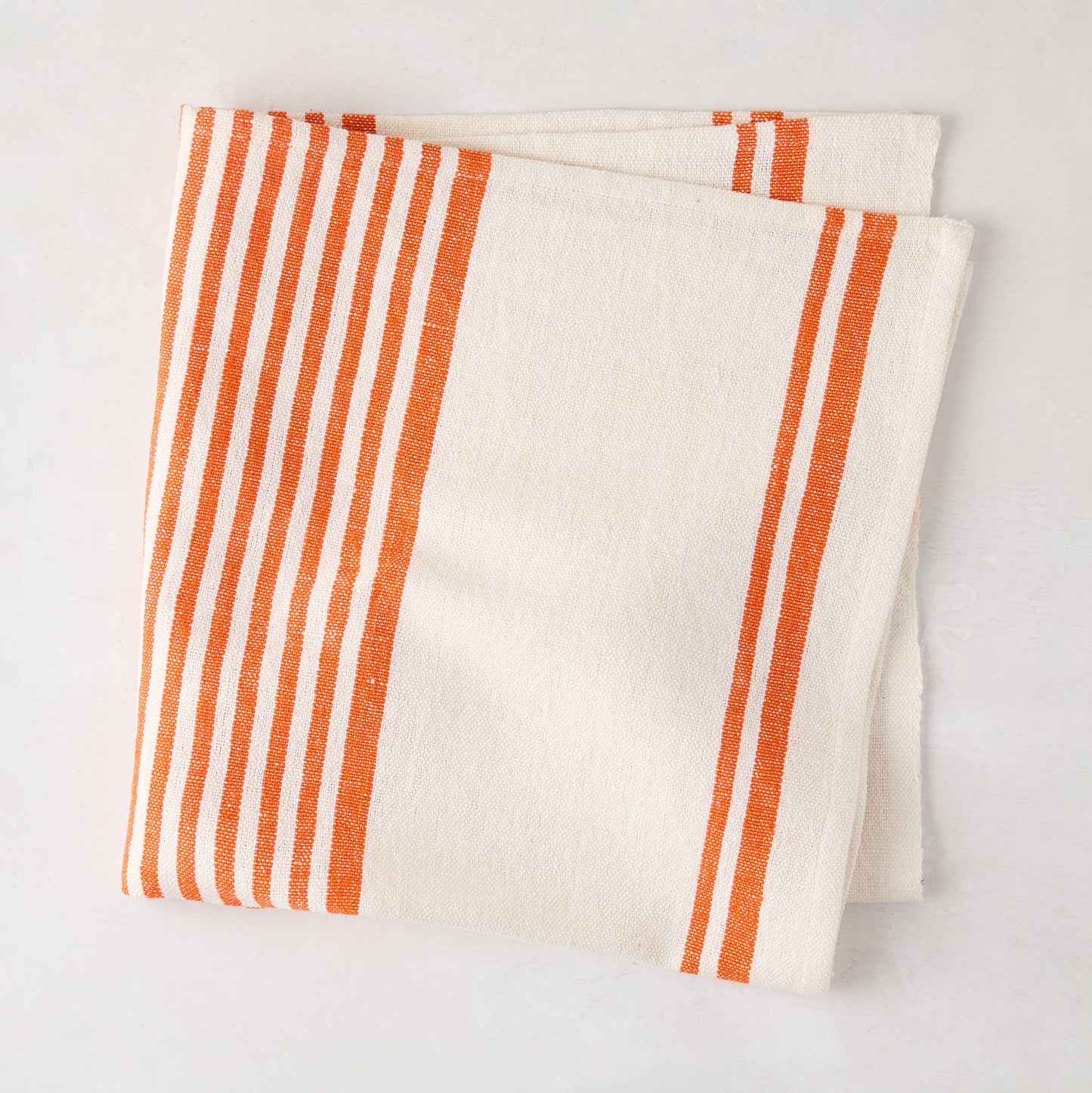 Orange Boat Stripe Napkin, folded, 22" square, cotton-linen blend.