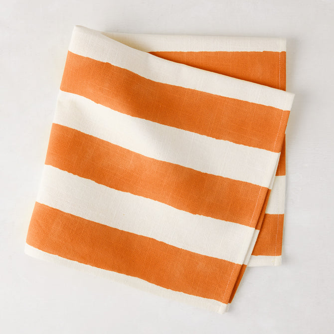 Orange Hampton Stripe Cotton Napkin, 22" square, folded with bold orange and white stripes.