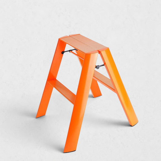 Hudson Grace orange Hasegawa Lucano 2-step ladder with a matte finish, grooved treads, and a sturdy metal frame.