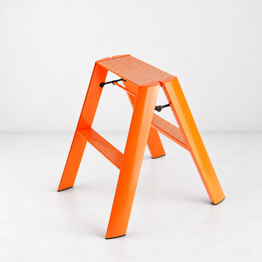 Orange Hasegawa Lucano 2-step ladder in matte aluminum and steel with grooved treads and a minimalist design.