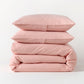 Stacked orange seersucker stripe organic cotton duvet and sham set.