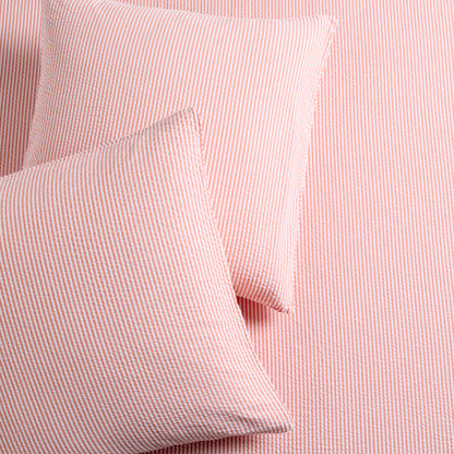 Set of 2 orange seersucker stripe organic cotton Euro shams with textured fabric.